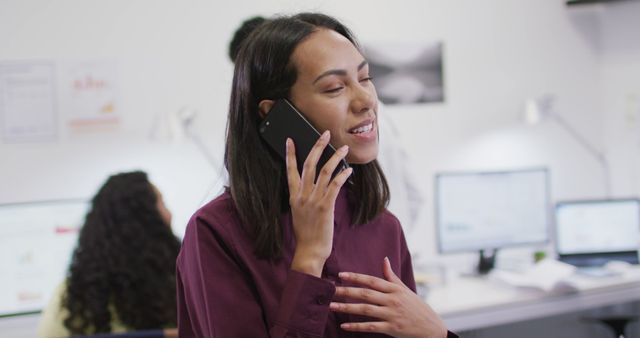 Businesswoman multitasking at office while talking on phone - Download Free Stock Images Pikwizard.com