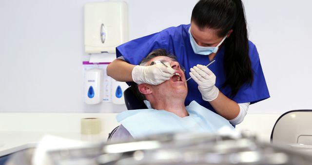 Dentist Treating Patient in Dental Clinic - Download Free Stock Images Pikwizard.com