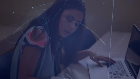 Teen Using Laptop with Digital Interface Overlay