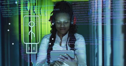 Midadult woman using tablet reading code with holographic interface in tech corridor