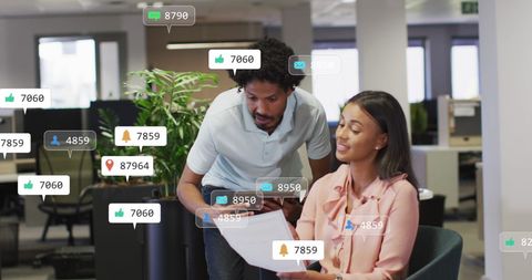 Diverse Coworkers Strategizing with Social Media Insights in Office