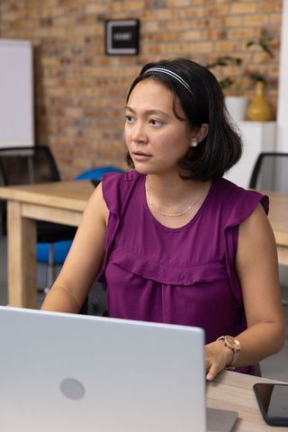 Focused Asian Businesswoman Working in Modern Office