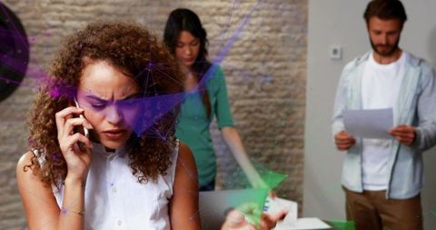 Stressed Businesswoman Making Urgent Call in Modern Office