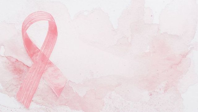 Pink Awareness Ribbon with Brushstroke and Watercolor Background