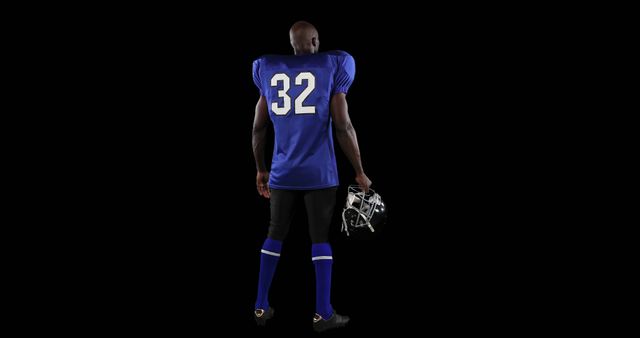 Rear View of American Football Player Holding Helmet - Download Free Stock Images Pikwizard.com