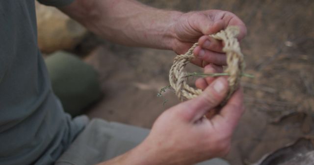 Hands Crafting Hemp Rope in Outdoor Survival Situation - Download Free Stock Images Pikwizard.com