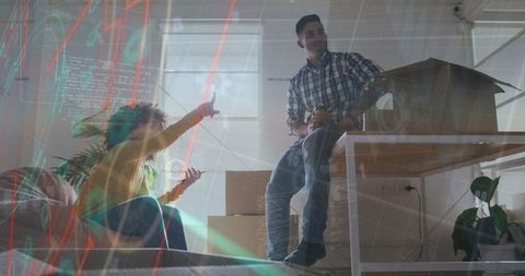 Unpacking couple plan room layout with scale model in modern living room