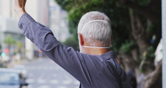 Senior Man Calling for Taxi on Busy Street - Download Free Stock Images Pikwizard.com