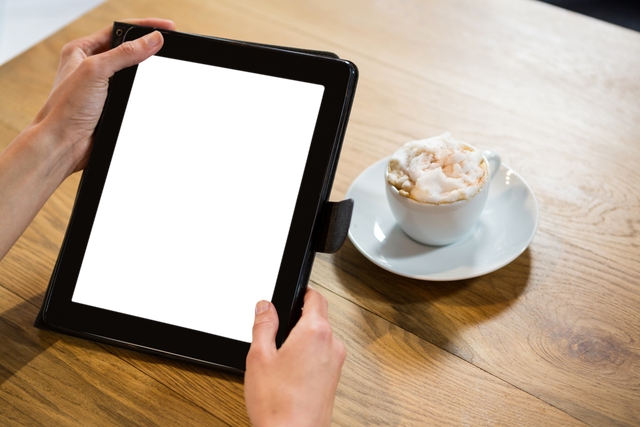 Transparent Tablet Screen in Cafe and Hands on Wooden Table - Download Free Stock Videos Pikwizard.com