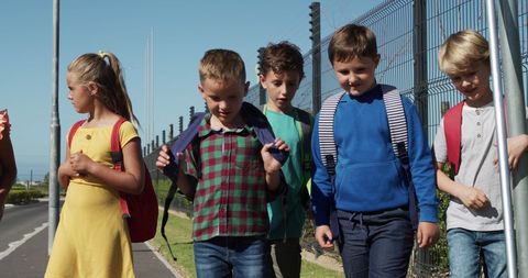 School Children Walking Together on a Sunny Day - Download Free Stock Images Pikwizard.com