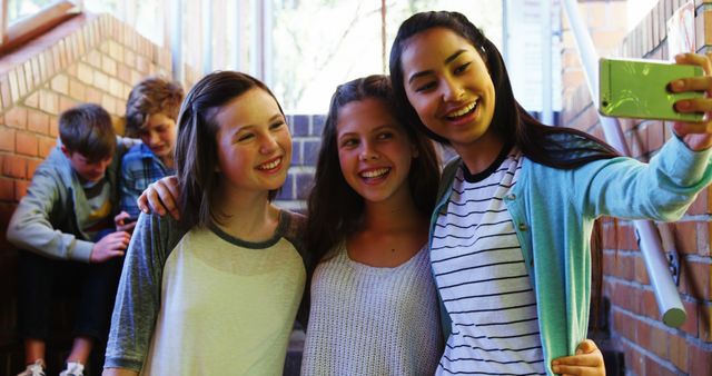 Teenage Girls Taking Selfie in School Corridor - Download Free Stock Images Pikwizard.com