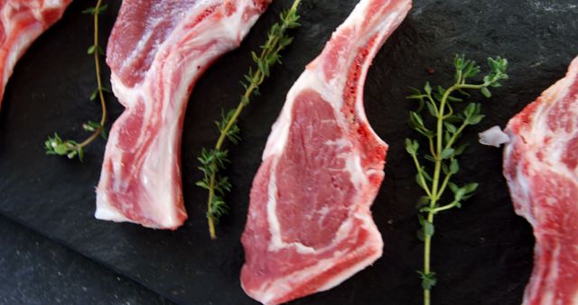 Fresh Uncooked Lamb Chops with Thyme on Slate Board - Download Free Stock Images Pikwizard.com