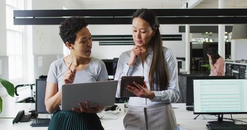 Diverse Businesswomen Collaborating in Modern Office Enviroment