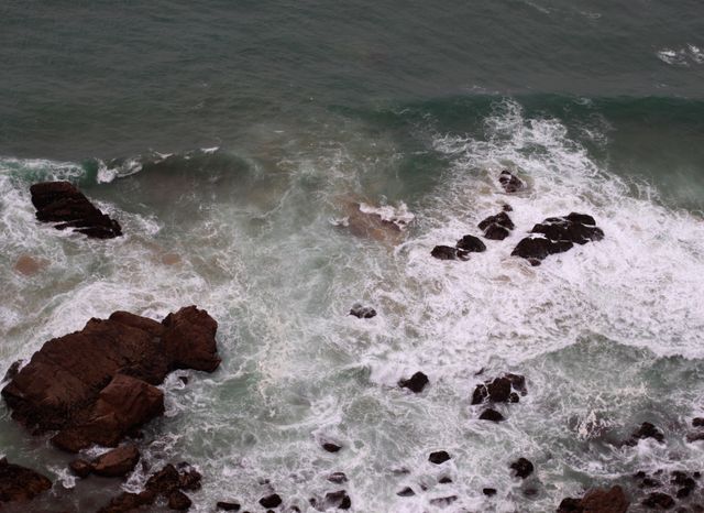 Waves Crashing on Rocky Coastline Viewed from Above - Download Free Stock Photos Pikwizard.com