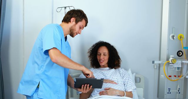 Nurse Assisting Smiling Pregnant Patient in Hospital Bed - Download Free Stock Images Pikwizard.com