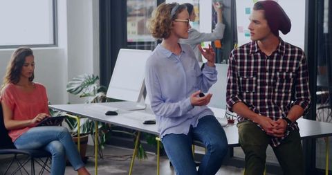 Creative Colleagues Sharing Ideas in Modern Office