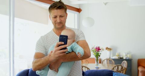 Father Taking Selfie with Baby in Comfortable Home Environment