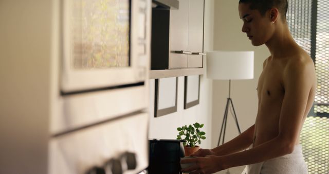 Shirtless Young Man Preparing Coffee in Modern Kitchen - Download Free Stock Images Pikwizard.com