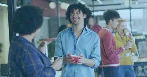 Diverse Team Engaging in Casual Office Discussion