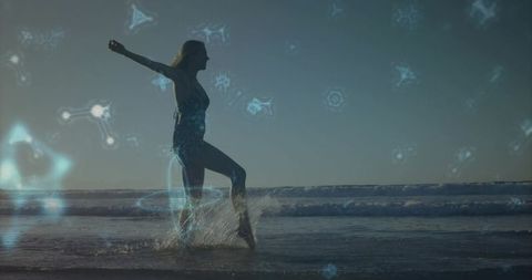 Silhouetted woman splashing through surf at sunrise with glowing blue digital overlays