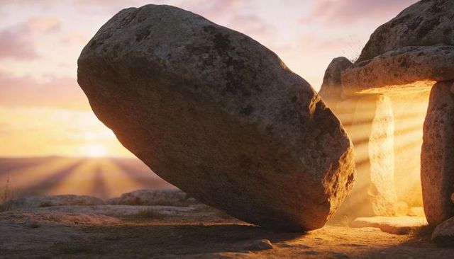 Ancient dolmen at dawn with leaning capstone casting golden sunbeams through entrance