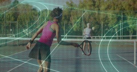 Dynamic Tennis Match on Outdoor Hardcourt Featuring Active Player