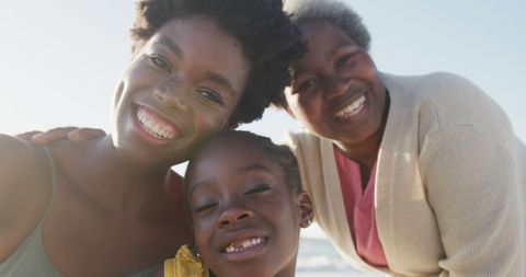 Happy Multigenerational African American Family on Beach Vacation