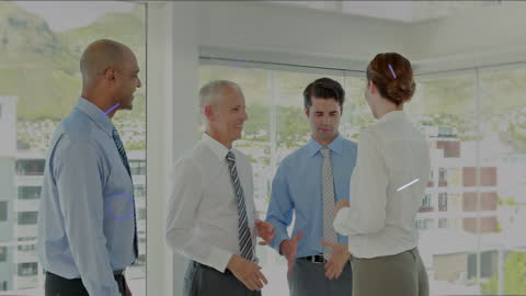 Diverse Business Team Shaking Hands in Modern Office Setting