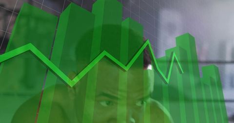 Focused man analyzing green 3d bar chart and jagged line graph on dashboard for analytics
