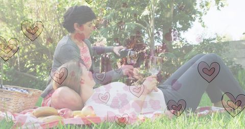 Couple Enjoying Wine in Romantic Picnic Setting