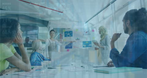 Diverse Team in Business Meeting with Financial Data Overlay