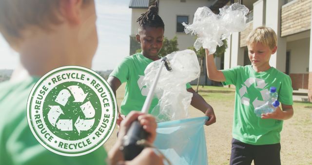 Children are gathering plastic waste and placing it in a recycling bag. They are outdoors, wearing green shirts with recycling symbols. This can be used for promotions related to environmental awareness, community clean-up activities, or educational materials on sustainability.