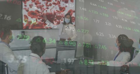 Healthcare Professionals Analyzing COVID-19 Data in Conference Room