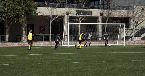 Intense Soccer Match with Players Highlighting Competition and Teamwork
