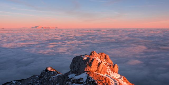 Mountain Peak Illuminated by Sunset Above Clouds - Download Free Stock Photos Pikwizard.com