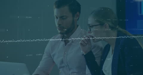 Colleagues Analyzing Data Overlaid with Technology Graphics