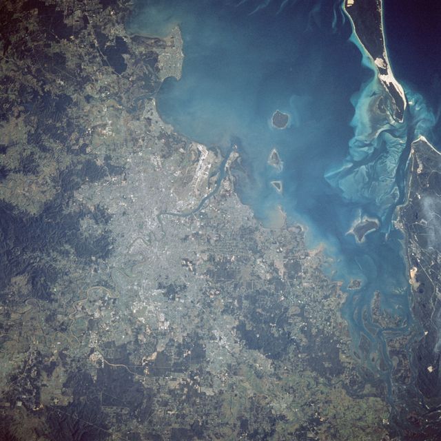 41D-41-062 (30 Aug-5 Sept 1984) --- An example of the surface details on the Earth seen by orbiting astronauts is provided by this Hasselblad 500 EL/M photograph made with a 250mm lens over Brisbane, Australia.  Urban areas and the airport complex lie along the   Brisbane River which empties into Moreton Bay. The photograph was shown during the STS-41D   postflight press conference held on September 12, 1984.