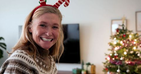 Festive Senior Woman Celebrating Christmas at Home