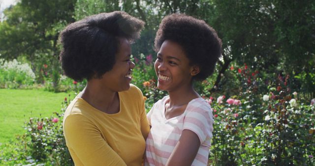 Happy Mother and Daughter Smiling in Garden - Download Free Stock Images Pikwizard.com