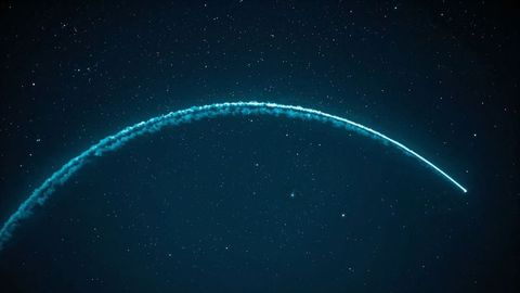 Teal Light Arc in Star-Filled Night Sky with Smoke Trail