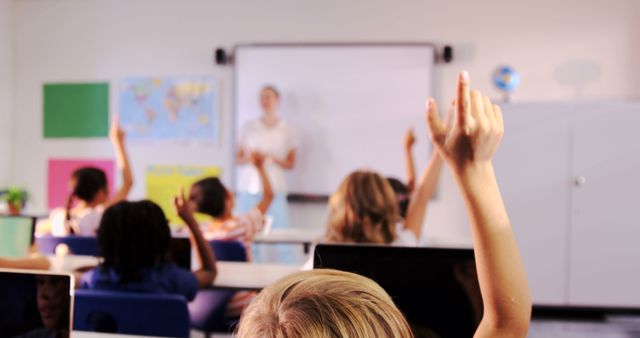 Students Raising Hands in Classroom with Teacher Presenting - Download Free Stock Images Pikwizard.com