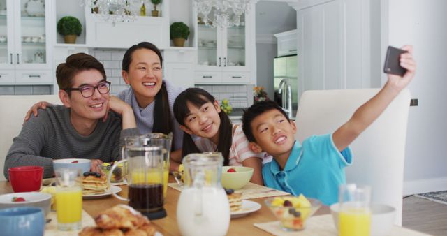 Family Enjoying Breakfast Together, Taking Selfie at Dining Table - Download Free Stock Images Pikwizard.com