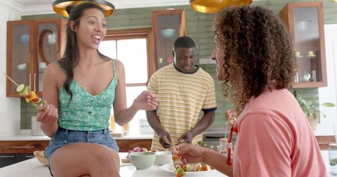 Friends Gathering for Enjoyable Kitchen Moment