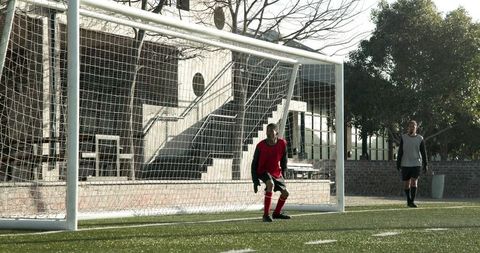 Intense Soccer Moment as Goalkeeper Prepares for Penalty