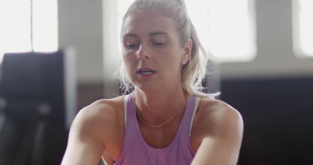 Focused Woman Exercising Indoors with Natural Light - Download Free Stock Images Pikwizard.com