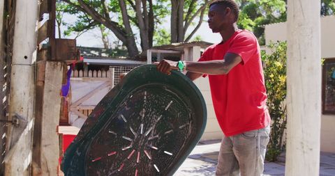 Volunteer caring for animal shelter cleaning dog baths