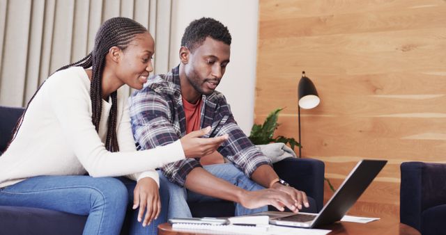 Happy African American Couple Shopping Online Together in Modern Living Room - Download Free Stock Images Pikwizard.com