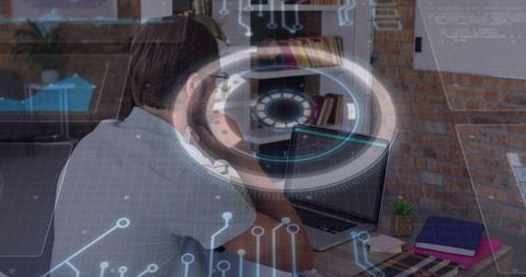 Bearded man typing on laptop with augmented reality hud overlay, remote work tech concept