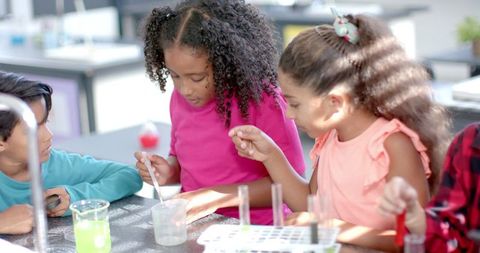 Diverse Group of Students Engaging in Science Experiment