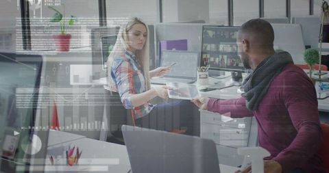 Innovative Workspace Collaboration: Colleagues Sharing Ideas on Tablet